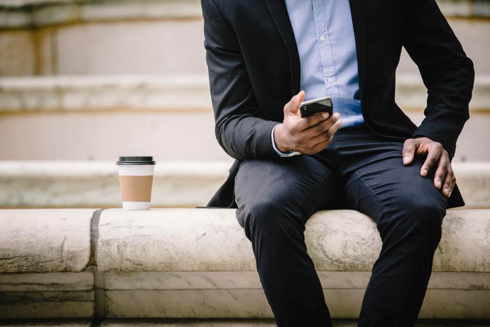 A man in a suit on his phone