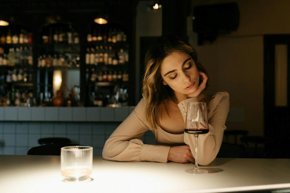 Woman looking at her wine glass